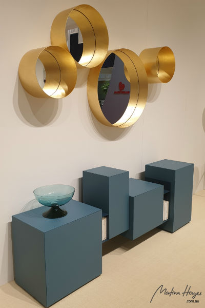 Blue side board and golden mirrors